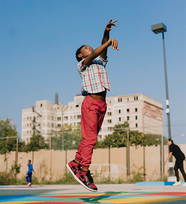 boy shooting hoops