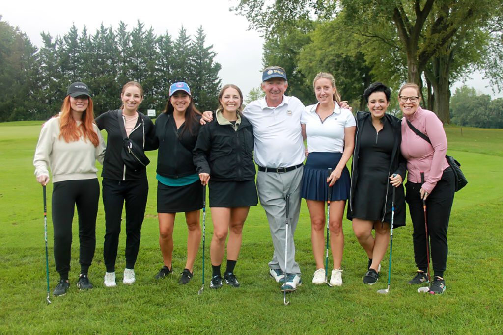 eight golfers at swing for the kids fundraiser